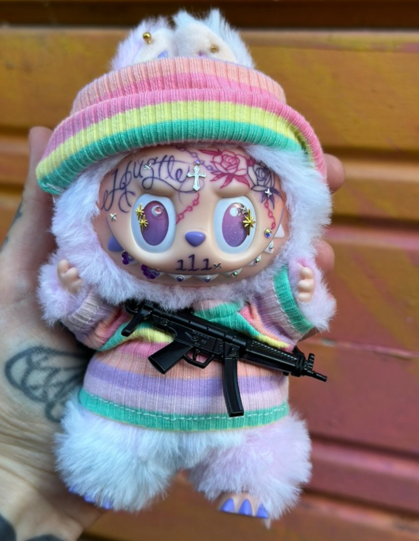 Custom Labubu with hand-drawn face tattoos by Tia Berry