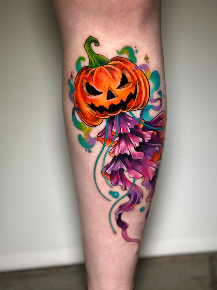 Jack-o-lantern jellyfish tattoo on the calf by Tia Berry, colour tattoo artist in Vancouver
