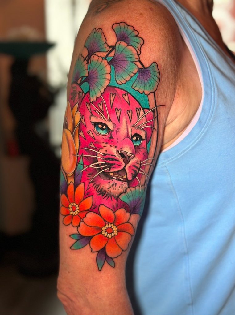 Pink lynx tattoo on the shoulder by Tia Berry, colour tattoo artist in Vancouver