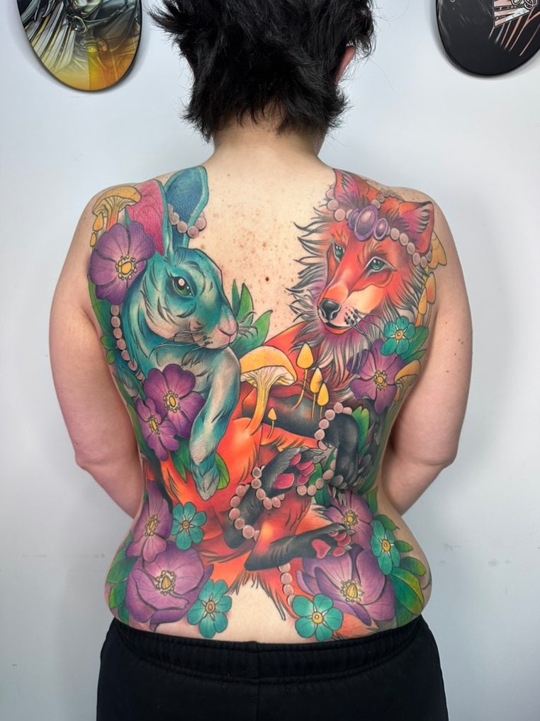 Rabbit and fox tattoo on the back piece by Tia Berry, colour tattoo artist in Vancouver